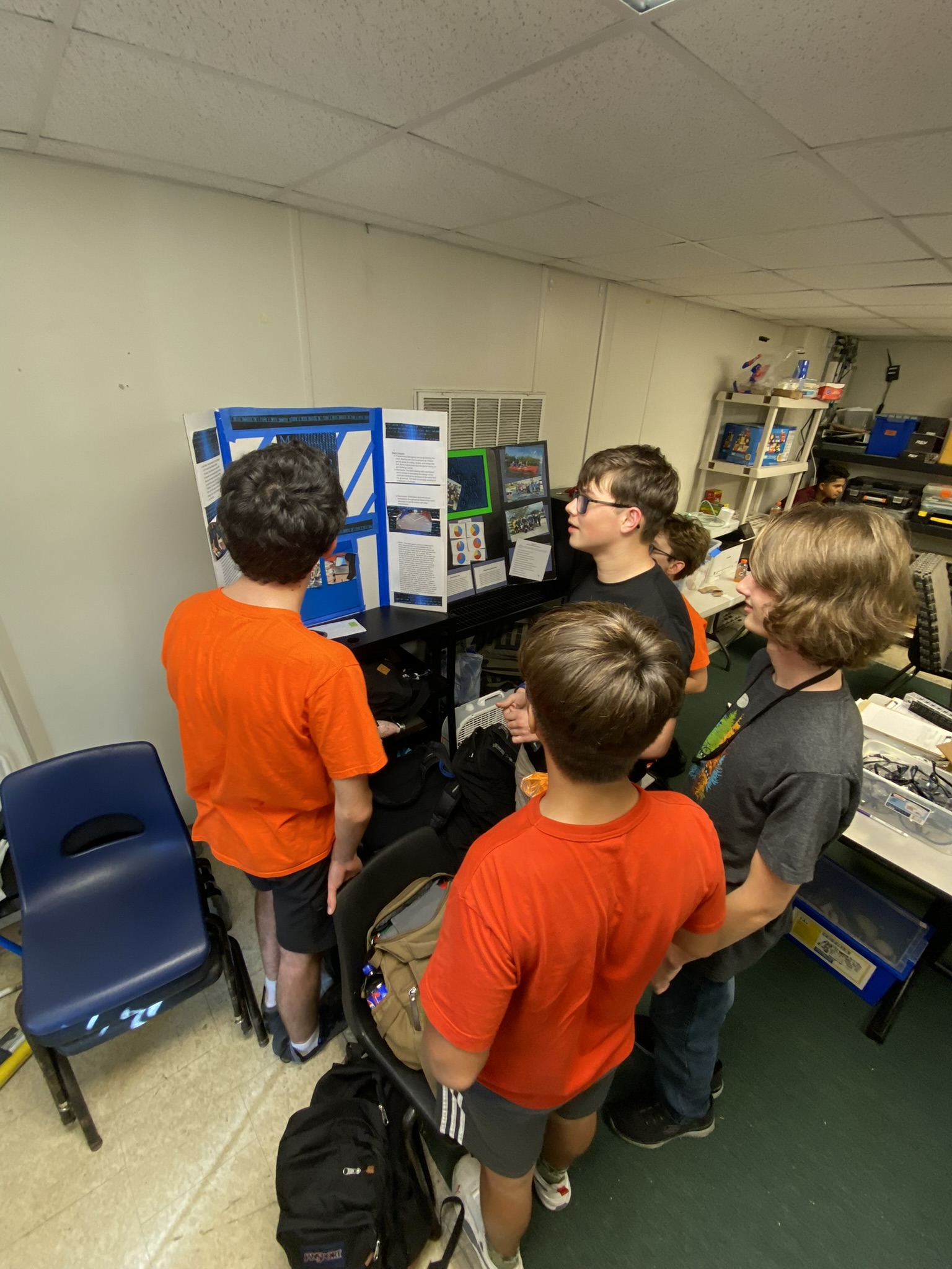 Team doing final assembly checks