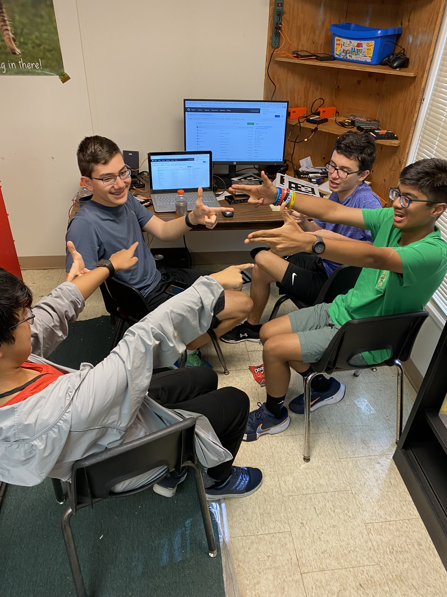 Mentor assisting students with wiring